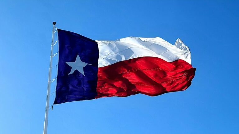 Texas flag flying over the state, illustrating the Texas THC ban